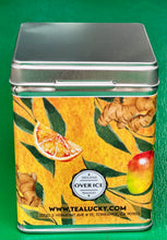 Load image into Gallery viewer, Tea canister with ginger, orange, and mango design on a green background

